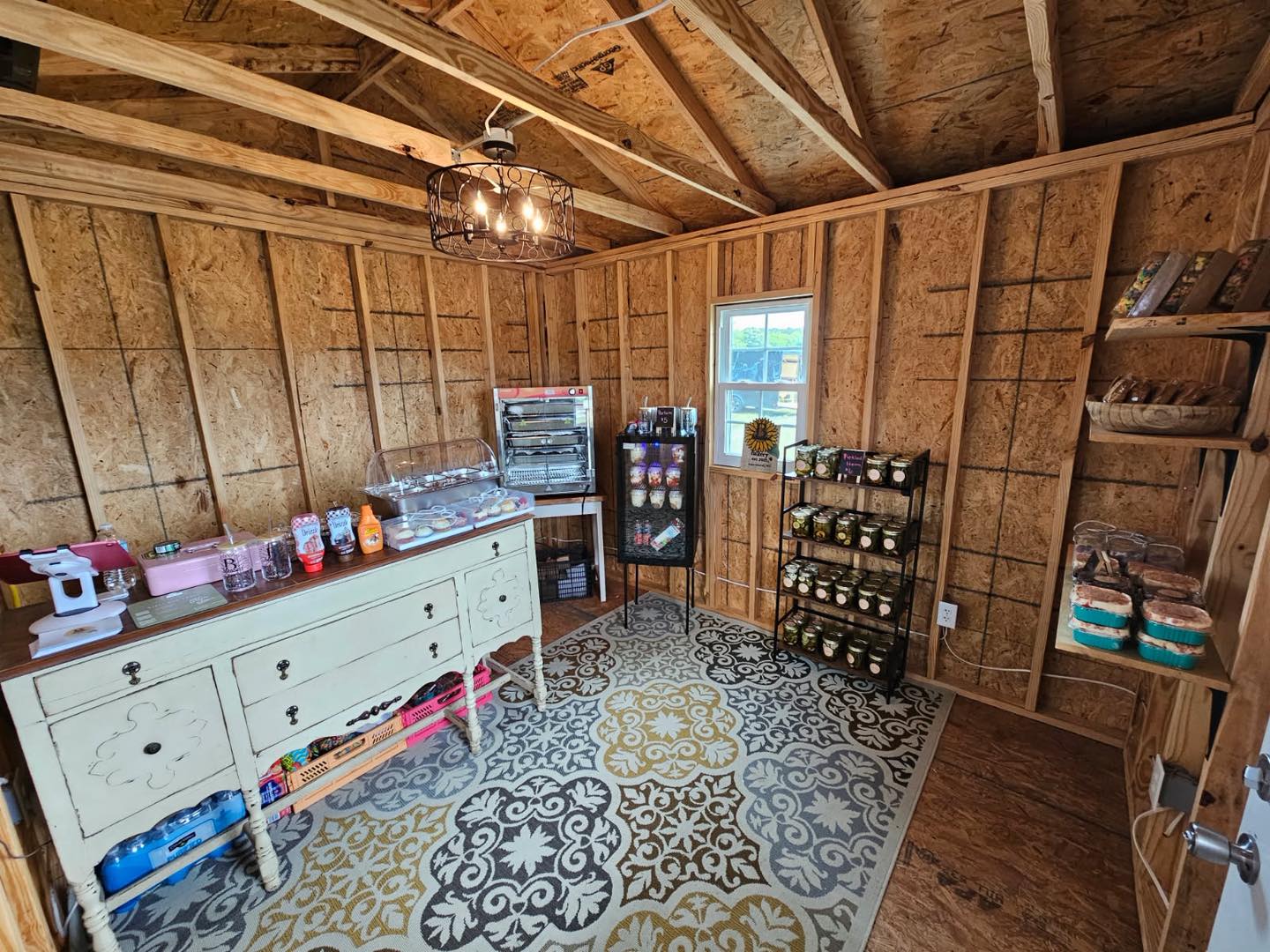 Inside the mini bake shop with fresh baked goods and pickled jars